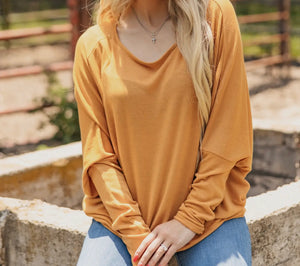 Mustard cuffed arm, long sleeve