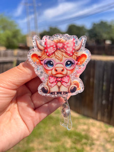 Cute heifer, bow glasses badge