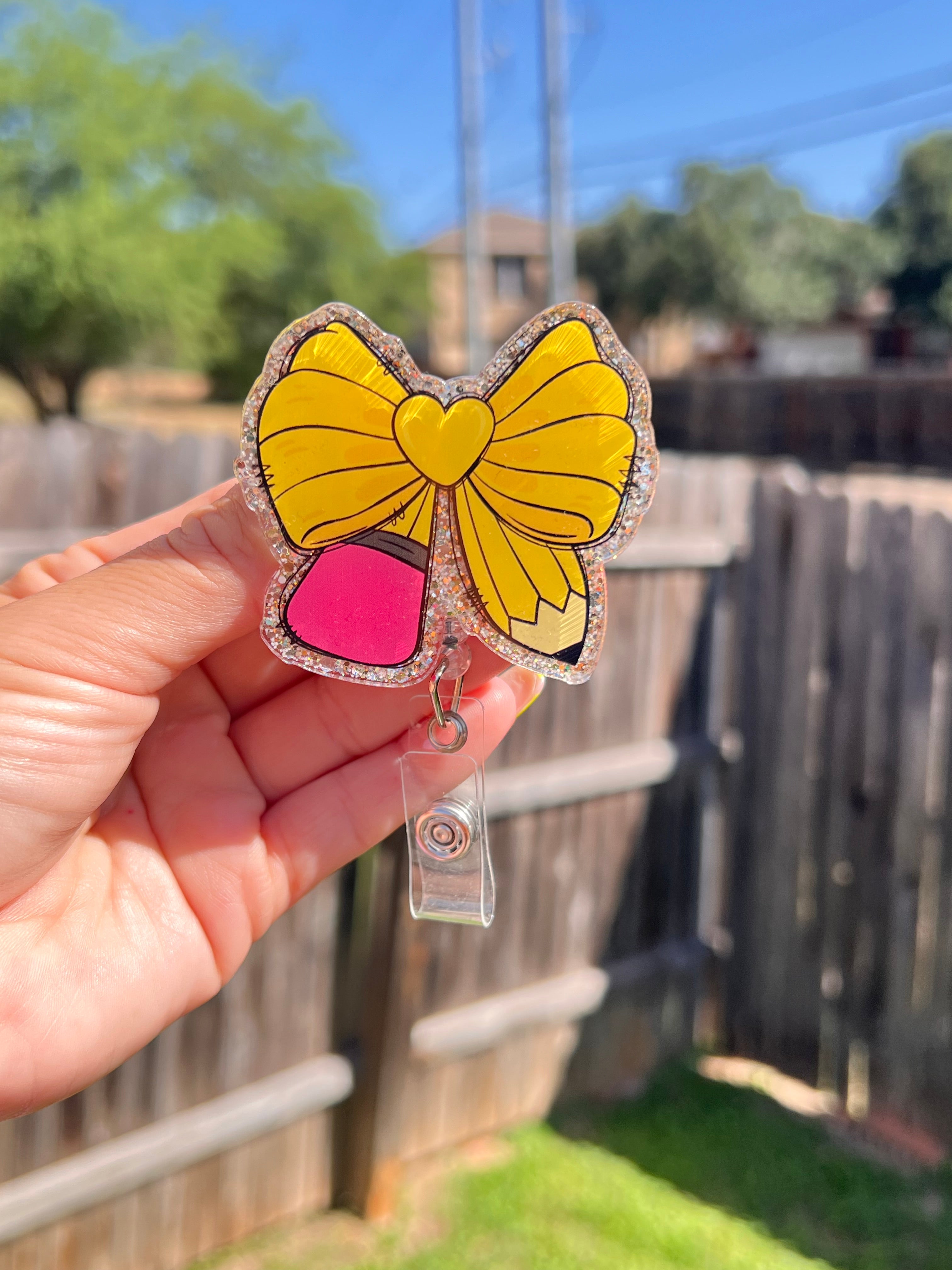 Pencil bow badge